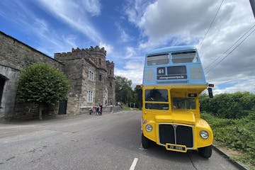 a double decker bus parked on the side of a road