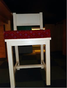 a chair sitting in front of a table