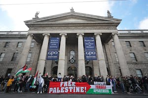 a group of people standing in front of the GPO