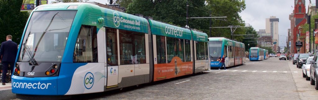 a passenger bus that is parked on the side of a road