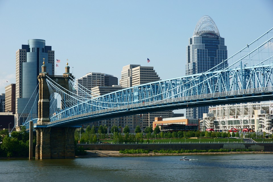 a train crossing a bridge over a body of water