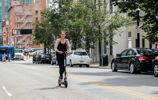 a person riding an electric scooter