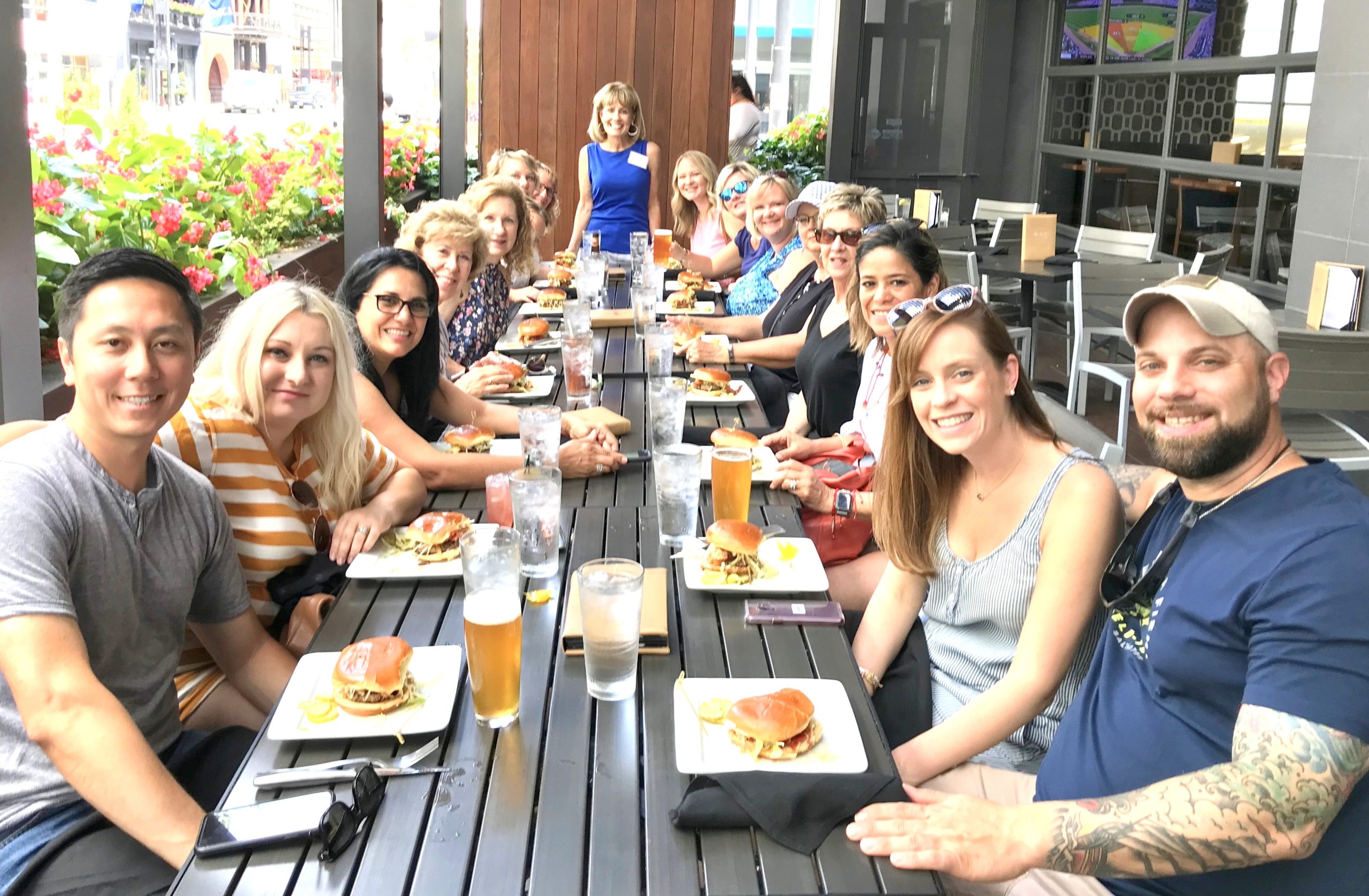 a group of people sitting at a table in a restaurant