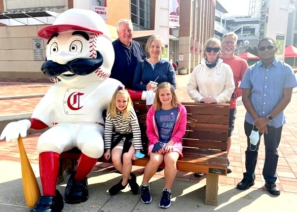 a group of people sitting on a bench