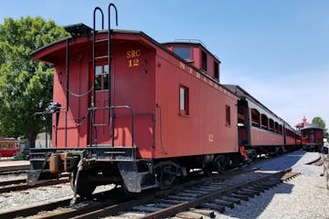 The outside view of the caboose parked on the tracks at the Strasburg Rail Road.