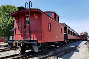 The outside view of the caboose parked on the tracks at the Strasburg Rail Road.