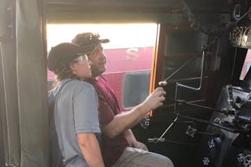 A person learning about in-cab experiences for train #611 at the Strasburg Rail Road.