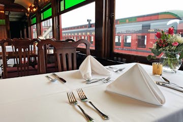 A nicely set table inside the dining car of the Strasburg Rail Road.