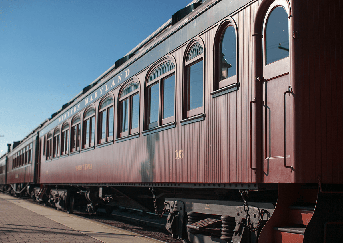 Exterior of a restored wooden passenger train car.