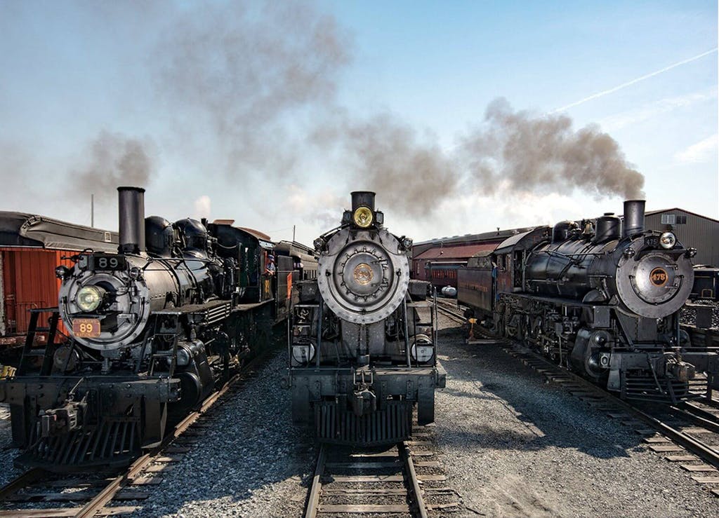 3 steam engines on the train tracks at Strasburg Rail Road