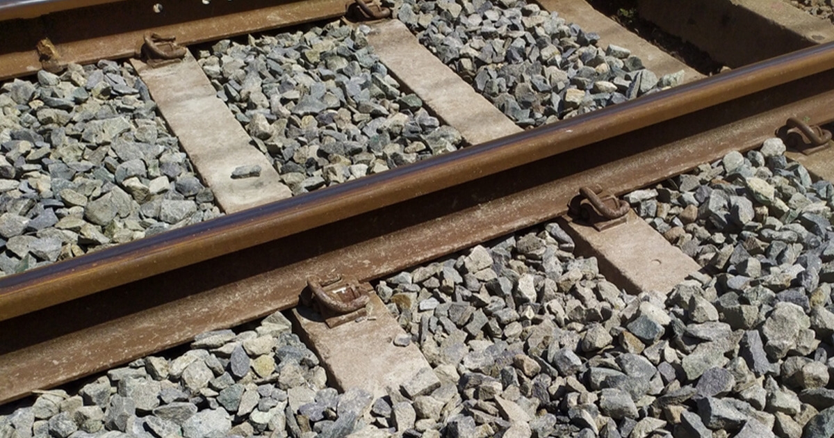 A close up of the rocks (also known as ballast) surrounding railroad beds.