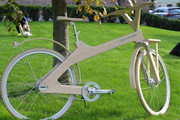a bicycle parked on the grass