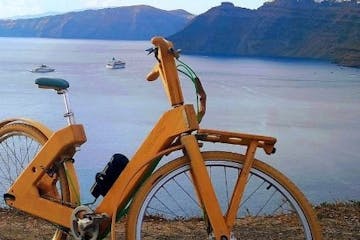 a bicycle parked in front of a body of water