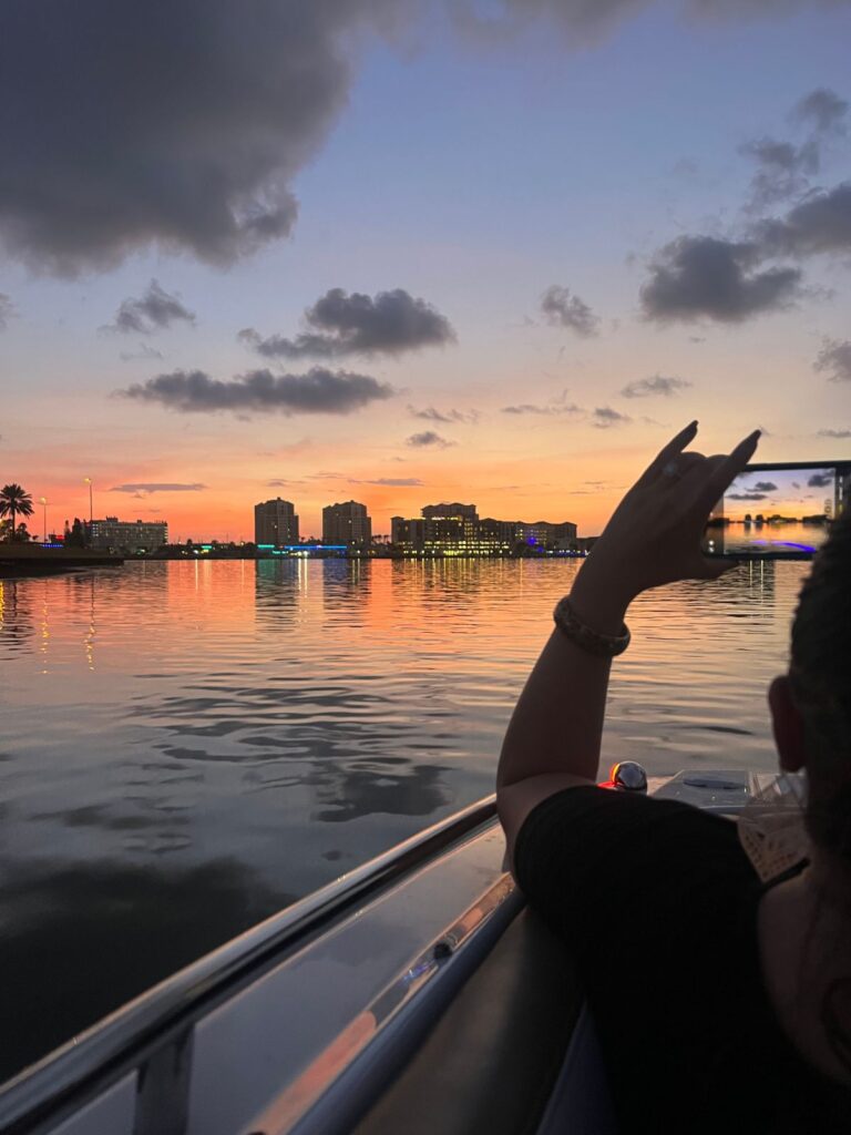 sunset in clearwater with silhouette of person taking a picture