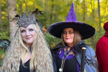 Two event attendees wearing Halloween costumes.