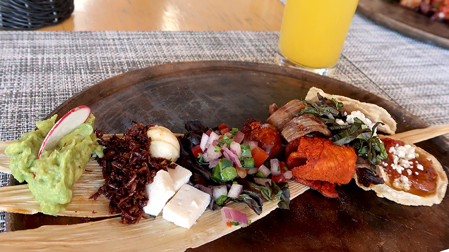 a plate of food sitting on top of a wooden table