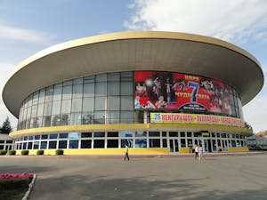 a stadium with a large building