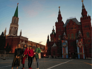 a group of people walking in front of Red Square