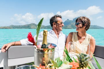 A couple onboard during a private boat tour in Bora Bora