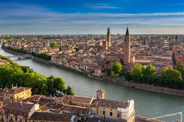 Verona over a body of water with a city in the background