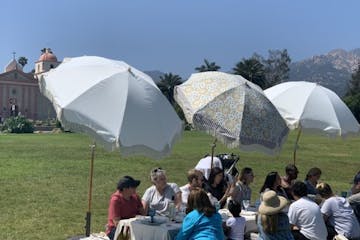 a group of people in an open umbrella