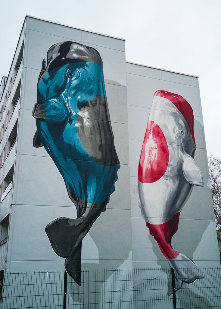 Reification by Nevercrew in Zillestraße in Charlottenburg showing two whales on seperate walls, both more looking like koi 
