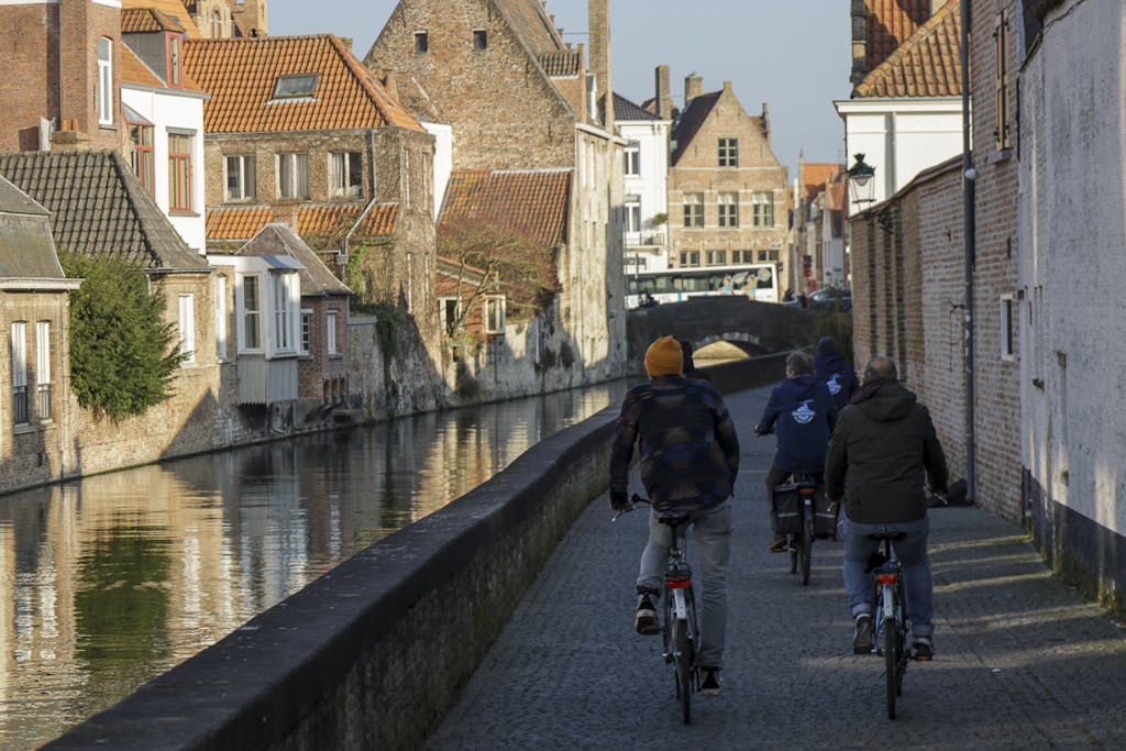 Cycling along the canal in Bruges