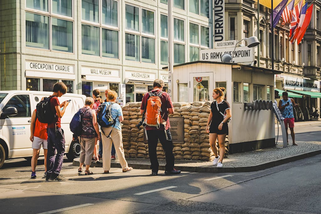 a group of people in front of former Checkpoint Charlie
