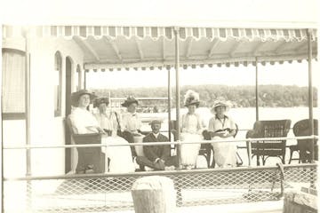 a group of people sitting in a chair
