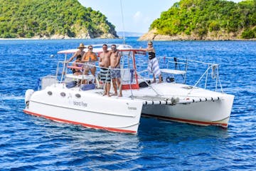 6 guests aboard Seas the Day Charters USVI private charter boat M/V Island Flyer posing for a photo