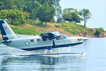 a airplane that is driving down the river