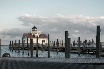 a view of a pier next to a body of water
