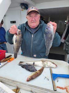 Dennis Skinner holding a fish