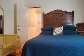 a bedroom with a large bed in a room