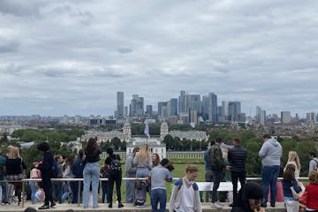 a group of people standing in a city