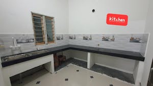 a kitchen with a sink and a mirror