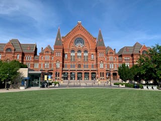 a large lawn in front of Cincinnati Music Hall