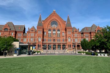 a large lawn in front of Cincinnati Music Hall