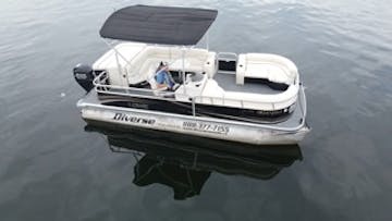 a white and black 20' pontoon boat rental from diverse boat rentals and tours