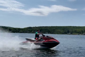 a man zipping on a jet ski on the water