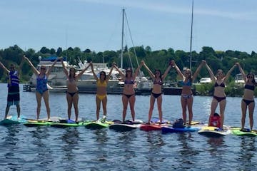 a group of people on stand up paddleboards