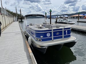 a boat is docked next to a body of water