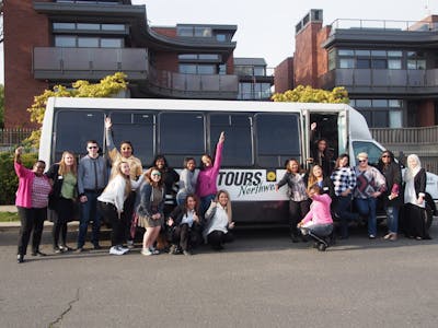 people posing in front of the Tours Northwest bus on Premier Seattle City Tour