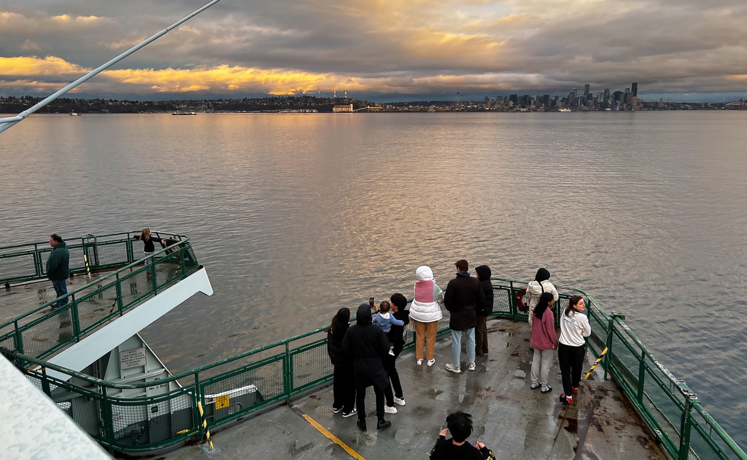 a group of people on a bridge over a body of water