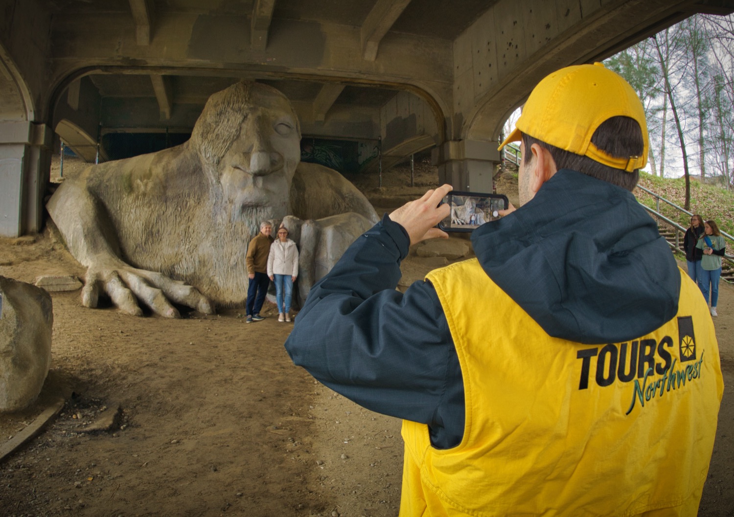 a tour guide taking pictures of guests