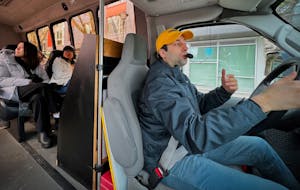 a tour guide driving a bus