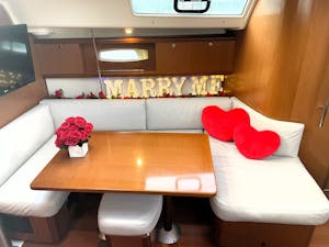 heart pillows and marry me sign and flowers for a couple boat rides near me and New York City