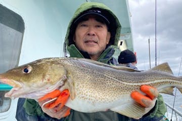 Kiyoshiro Imawano holding a fish