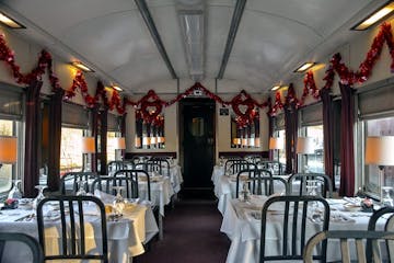 Vintage 1924 dining car decorated for Valentine's Day with tables set for a romantic train ride meal.