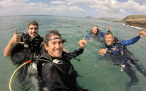 Caio Castro et al. swimming in a body of water